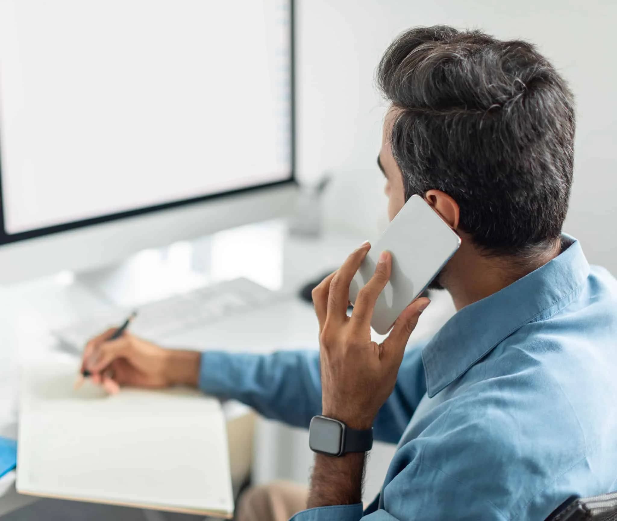 Attorney on phone reviewing lien documents